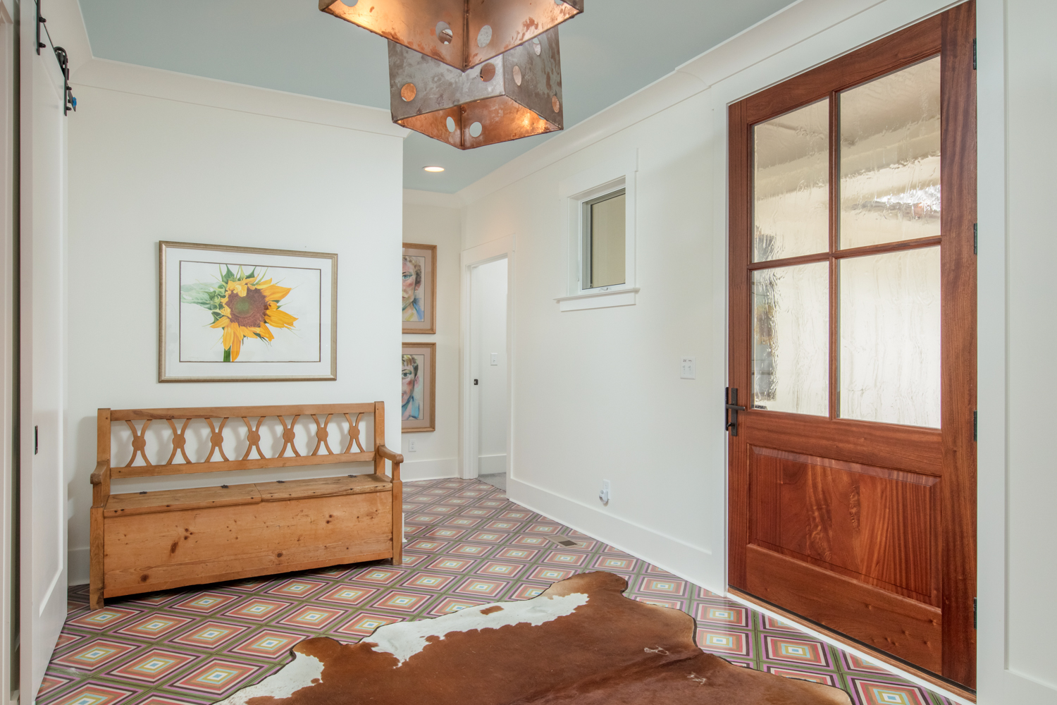 Entryway to home with a cowhide rug.