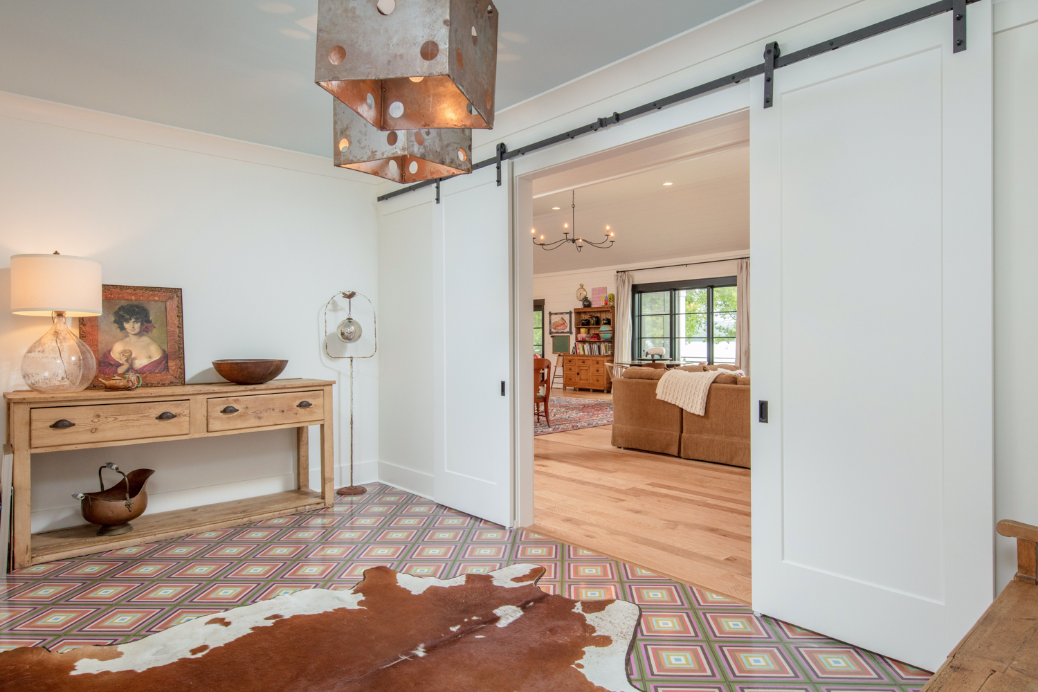 Entryway to home with a cowhide rug.