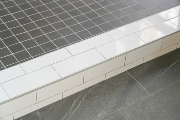 Subway tile floor with black tile and white tile